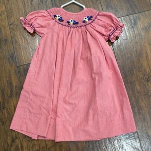 Red smocked police dress. Long dress